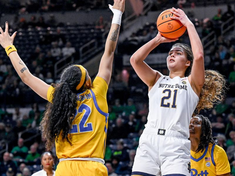 Feb 9, 2023; South Bend, Indiana, USA; Notre Dame Fighting Irish forward Maddy Westbeld (21) shoots over Pittsburgh Panthers forward Gabby Hutcherson (22) in the second half at the Purcell Pavilion. Mandatory Credit: Matt Cashore-USA TODAY Sports