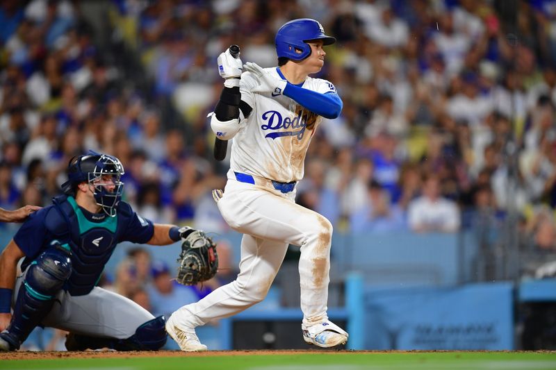 Aug 19, 2024; Los Angeles, California, USA; Los Angeles Dodgers designated hitter Shohei Ohtani (17) runs out a ground ball against the Seattle Mariners during the sixth inning at Dodger Stadium. Mandatory Credit: Gary A. Vasquez-USA TODAY Sports