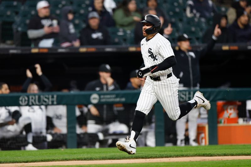 Apr 26, 2024; Chicago, Illinois, USA; Chicago White Sox shortstop Danny Mendick (0) runs to score against the Tampa Bay Rays during the fourth inning at Guaranteed Rate Field. Mandatory Credit: Kamil Krzaczynski-USA TODAY Sports