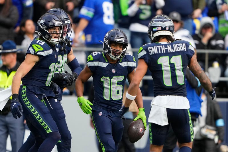 Seattle Seahawks wide receiver Tyler Lockett (16) celebrates with teammates during the first half of an NFL football game against the Los Angeles Rams in Seattle, Sunday, Nov. 3, 2024. (AP Photo/Lindsey Wasson)