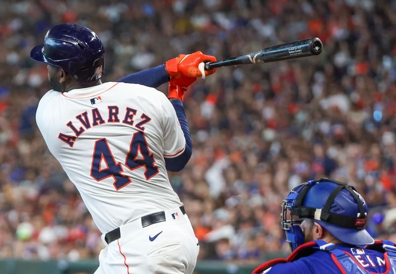 Apr 13, 2024; Houston, Texas, USA; Houston Astros left fielder Yordan Alvarez (44) hits a single against the Texas Rangers in the fourth inning at Minute Maid Park. Mandatory Credit: Thomas Shea-USA TODAY Sports