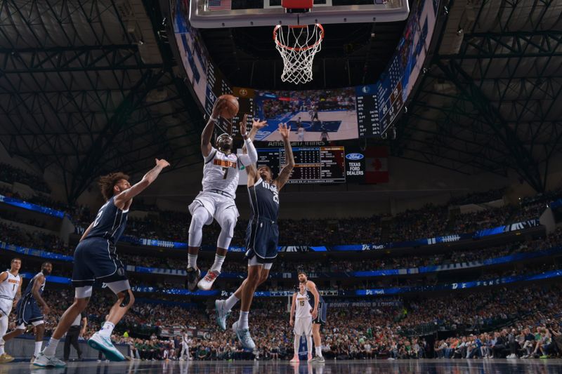 DALLAS, TX - MARCH 17: Reggie Jackson #7 of the Denver Nuggets drives to the basket during the game against the Dallas Mavericks on March 17, 2024 at the American Airlines Center in Dallas, Texas. NOTE TO USER: User expressly acknowledges and agrees that, by downloading and or using this photograph, User is consenting to the terms and conditions of the Getty Images License Agreement. Mandatory Copyright Notice: Copyright 2024 NBAE (Photo by Glenn James/NBAE via Getty Images)