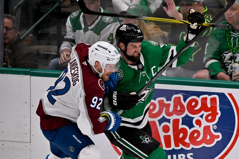 May 3, 2025; Dallas, Texas, USA; Colorado Avalanche left wing Gabriel Landeskog (92) and Dallas Stars left wing Jamie Benn (14) chase the puck during the second period in game seven of the first round of the 2025 Stanley Cup Playoffs at American Airlines Center. Mandatory Credit: Jerome Miron-Imagn Images