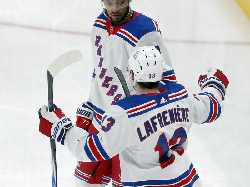 Mar 16, 2024; Pittsburgh, Pennsylvania, USA;  New York Rangers left wing Alexis Lafreniere (13) congratulates defenseman K'Andre Miller (79) after Miller scored a goal against the Pittsburgh Penguins during the third period at PPG Paints Arena. New York won 7-4. Mandatory Credit: Charles LeClaire-USA TODAY Sports