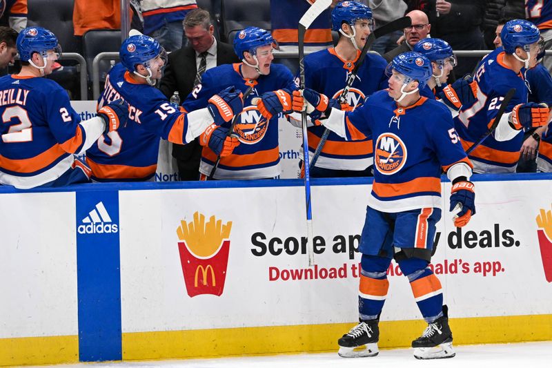 Apr 11, 2024; Elmont, New York, USA; New York Islanders center Casey Cizikas (53) celebrates his goal against the Montreal Canadiens with the New York Islanders bench during the third period at UBS Arena. Mandatory Credit: Dennis Schneidler-USA TODAY Sports