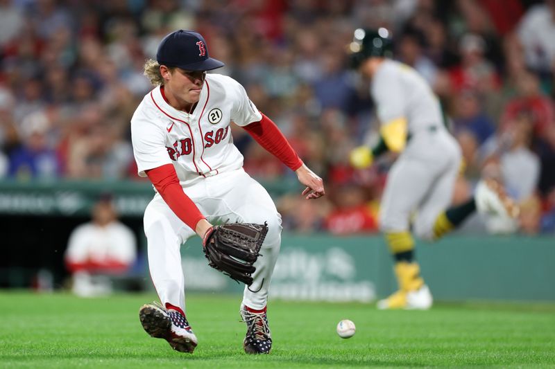 Sep 16, 2025; Boston, Massachusetts, USA; Boston Red Sox starting pitcher Connelly Early (71) fields a roundball during the fifth inning against the Athletics at Fenway Park. Mandatory Credit: Paul Rutherford-Imagn Images