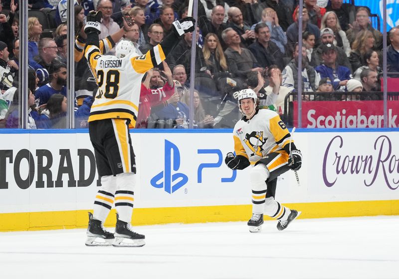 Apr 8, 2024; Toronto, Ontario, CAN; Pittsburgh Penguins right wing Rickard Rakell (67) reacts after he scores a goal and celebrates with defenseman Marcus Pettersson (28) against the Toronto Maple Leafs during the first period at Scotiabank Arena. Mandatory Credit: Nick Turchiaro-USA TODAY Sports