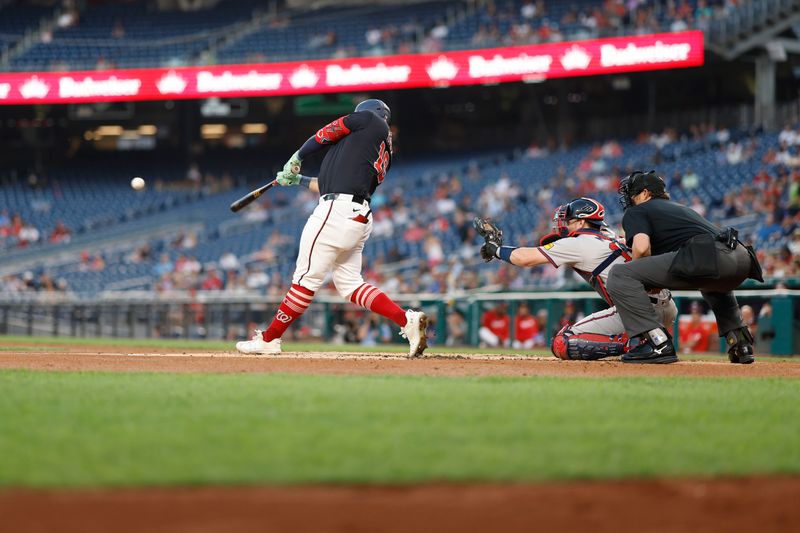 Sep 11, 2024; Washington, District of Columbia, USA; Washington Nationals first baseman Juan Yepez (18) singles against the Atlanta Braves during the second inning at Nationals Park. Mandatory Credit: Geoff Burke-Imagn Images