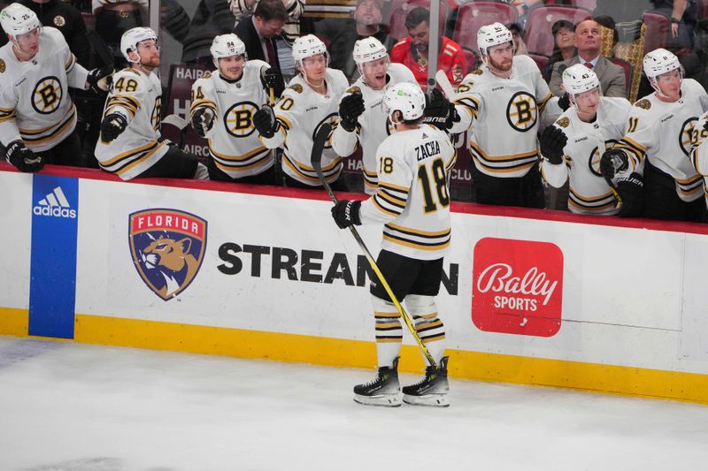 Mar 26, 2024; Sunrise, Florida, USA; Boston Bruins center Pavel Zacha (18) celebrates his goal against the Florida Panthers during the third period with teammates at Amerant Bank Arena. Mandatory Credit: Jim Rassol-USA TODAY Sports