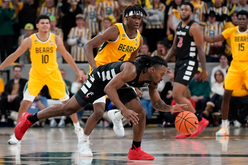 Jan 13, 2024; Waco, Texas, USA; Cincinnati Bearcats guard Day Day Thomas (1) controls the loose ball in front of Baylor Bears guard Ja'Kobe Walter (4) during the second half at Paul and Alejandra Foster Pavilion. Mandatory Credit: Raymond Carlin III-USA TODAY Sports