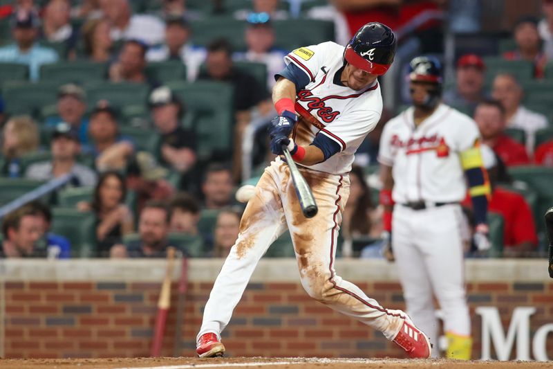 Aug 14, 2023; Atlanta, Georgia, USA; Atlanta Braves second baseman Nicky Lopez (15) hits a RBI single against the New York Yankees in the third inning at Truist Park. Mandatory Credit: Brett Davis-USA TODAY Sports