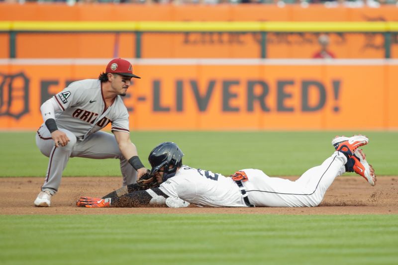 Jun 9, 2023; Detroit, Michigan, USA; Arizona Diamondbacks shortstop Josh Rojas (10) tags out Detroit Tigers Javier B ez (28) at third base during the first inning at Comerica Park. Mandatory Credit: Brian Bradshaw Sevald-USA TODAY Sports