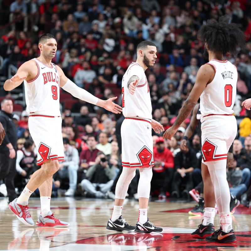 CHICAGO, IL - FEBRUARY 4:  Nikola Vucevic #9, Lonzo Ball #2 and Coby White #0 of the Chicago Bulls look on during the game against the Miami Heat on February 4 2025 at United Center in Chicago, Illinois. NOTE TO USER: User expressly acknowledges and agrees that, by downloading and or using this photograph, User is consenting to the terms and conditions of the Getty Images License Agreement. Mandatory Copyright Notice: Copyright 2025 NBAE (Photo by Jeff Haynes/NBAE via Getty Images)