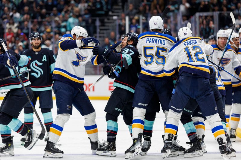 Oct 8, 2024; Seattle, Washington, USA; Seattle Kraken and St. Louis Blues players scuffle during the second period at Climate Pledge Arena. Mandatory Credit: Caean Couto-Imagn Images