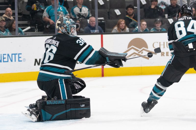 Feb 29, 2024; San Jose, California, USA; San Jose Sharks goaltender Kaapo Kahkonen (36) deflects the puck with his stick during the first period against the Anaheim Ducks at SAP Center at San Jose. Mandatory Credit: Stan Szeto-USA TODAY Sports