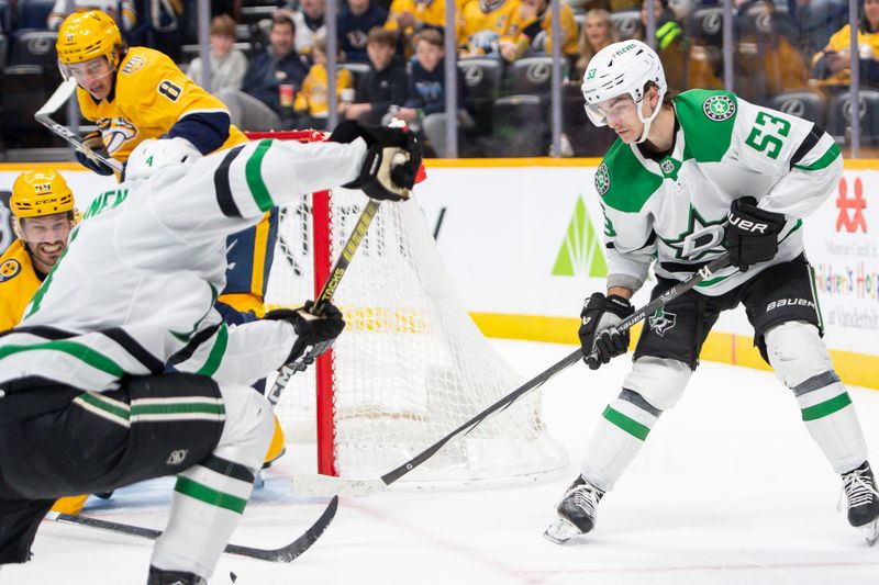 Feb 15, 2024; Nashville, Tennessee, USA; Dallas Stars defenseman Miro Heiskanen (4) scores past Nashville Predators goalie Kevin Lankinen (32) during the second period at Bridgestone Arena. Mandatory Credit: Steve Roberts-USA TODAY Sports