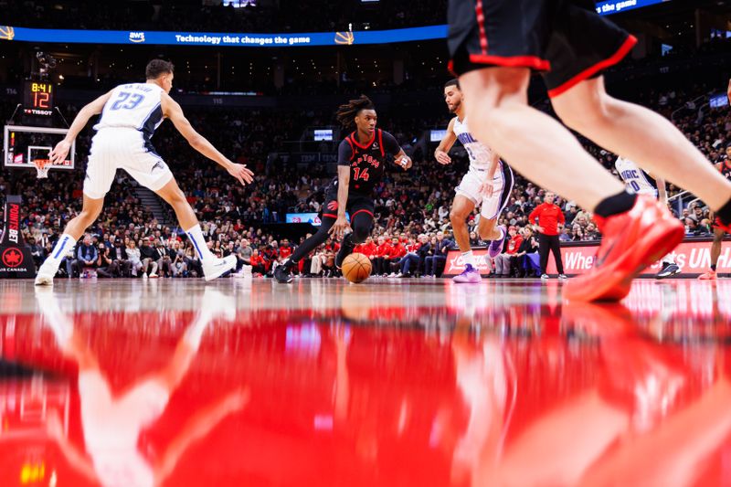 TORONTO, CANADA - JANUARY 3: Ja'Kobe Walter #14 of the Toronto Raptors dribbles the ball against the Orlando Magic during second half of their NBA game at Scotiabank Arena on January 3, 2025 in Toronto, Canada. NOTE TO USER: User expressly acknowledges and agrees that, by downloading and or using this photograph, User is consenting to the terms and conditions of the Getty Images License Agreement. (Photo by Cole Burston/Getty Images)