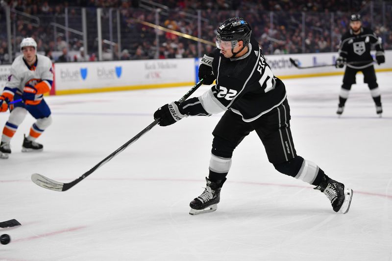 Mar 11, 2024; Los Angeles, California, USA; Los Angeles Kings left wing Kevin Fiala (22) shoots on goal against the New York Islanders during the second period at Crypto.com Arena. Mandatory Credit: Gary A. Vasquez-USA TODAY Sports