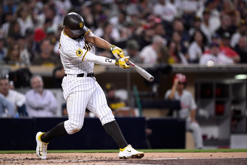 Sep 5, 2023; San Diego, California, USA; San Diego Padres shortstop Xander Bogaerts (2) hits a single against the Philadelphia Phillies during the third inning at Petco Park. Mandatory Credit: Orlando Ramirez-USA TODAY Sports