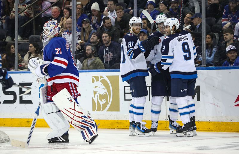 Mar 19, 2024; New York, New York, USA; Winnipeg Jets center Mark Scheifele (55) celebrates his goal against the New York Rangers with left wing Kyle Connor (81) and left wing Alex Iafallo (9) during the second period at Madison Square Garden. Mandatory Credit: Danny Wild-USA TODAY Sports