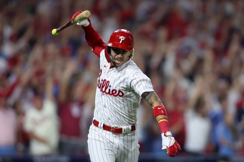 Oct 4, 2023; Philadelphia, Pennsylvania, USA; Philadelphia Phillies second baseman Bryson Stott (5) reacts after hitting  a grand slam against the Miami Marlins during the sixth inning for game two of the Wildcard series for the 2023 MLB playoffs at Citizens Bank Park. Mandatory Credit: Bill Streicher-USA TODAY Sports