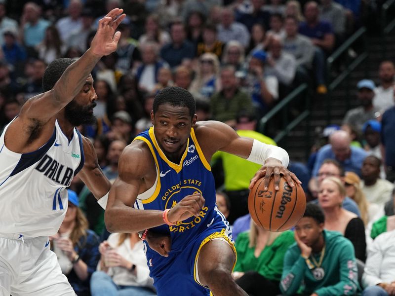 DALLAS, TX - MARCH 13: Jonathan Kuminga #00 of the Golden State Warriors drives to the basket during the game against the Dallas Mavericks on March 13, 2024 at the American Airlines Center in Dallas, Texas. NOTE TO USER: User expressly acknowledges and agrees that, by downloading and or using this photograph, User is consenting to the terms and conditions of the Getty Images License Agreement. Mandatory Copyright Notice: Copyright 2024 NBAE (Photo by Glenn James/NBAE via Getty Images)