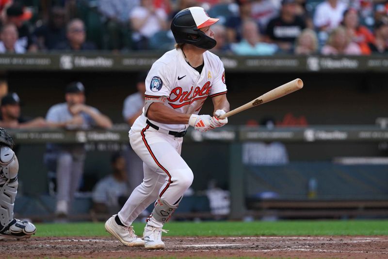 Sep 2, 2024; Baltimore, Maryland, USA; Baltimore Orioles second baseman Jackson Holliday (7) connects on a double during the seventh inning against the Chicago White Sox at Oriole Park at Camden Yards. Mandatory Credit: Mitch Stringer-USA TODAY Sports