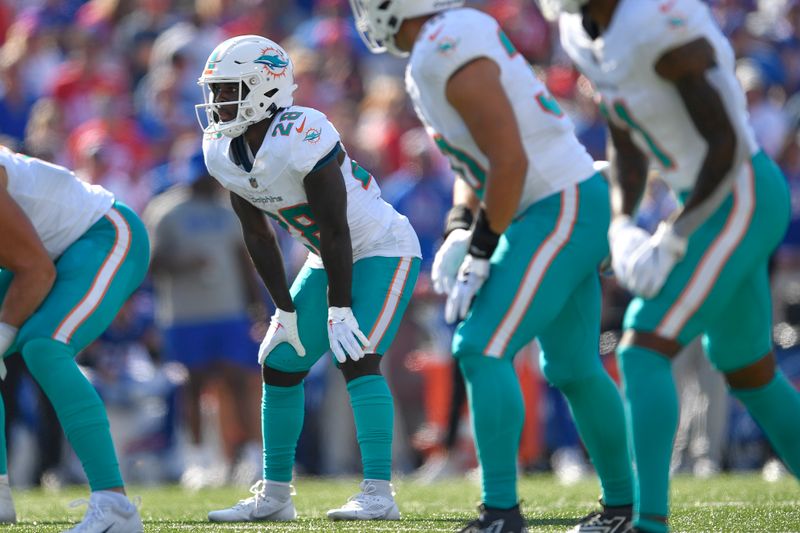 Miami Dolphins running back De'Von Achane, left, lines up during the second half of an NFL football game against the Buffalo Bills in Orchard Park, N.Y., Sunday, Oct. 1, 2023. (AP Photo/Adrian Kraus)