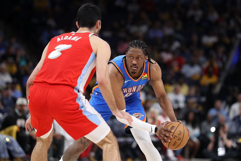 MEMPHIS, TENNESSEE - APRIL 26: Jalen Williams #8 of the Oklahoma City Thunder handles the ball against Santi Aldama #7 of the Memphis Grizzlies during the second half of Game Four of the Western Conference First Round NBA Playoffs at FedExForum on April 26, 2025 in Memphis, Tennessee. NOTE TO USER: User expressly acknowledges and agrees that, by downloading and or using this photograph, User is consenting to the terms and conditions of the Getty Images License Agreement. (Photo by Justin Ford/Getty Images)