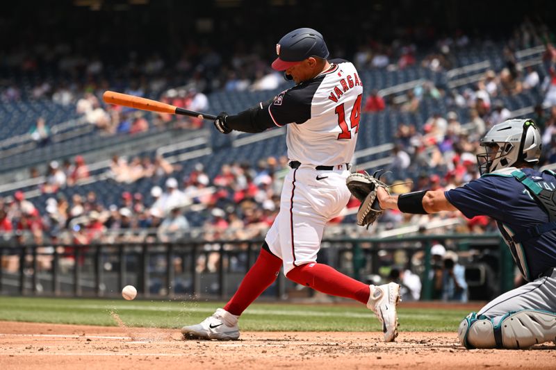 May 26, 2024; Washington, District of Columbia, USA; Washington Nationals second baseman Ildemaro Vargas (14) hits the ball into play against the Seattle Mariners during the second inning at Nationals Park. Mandatory Credit: Rafael Suanes-USA TODAY Sports