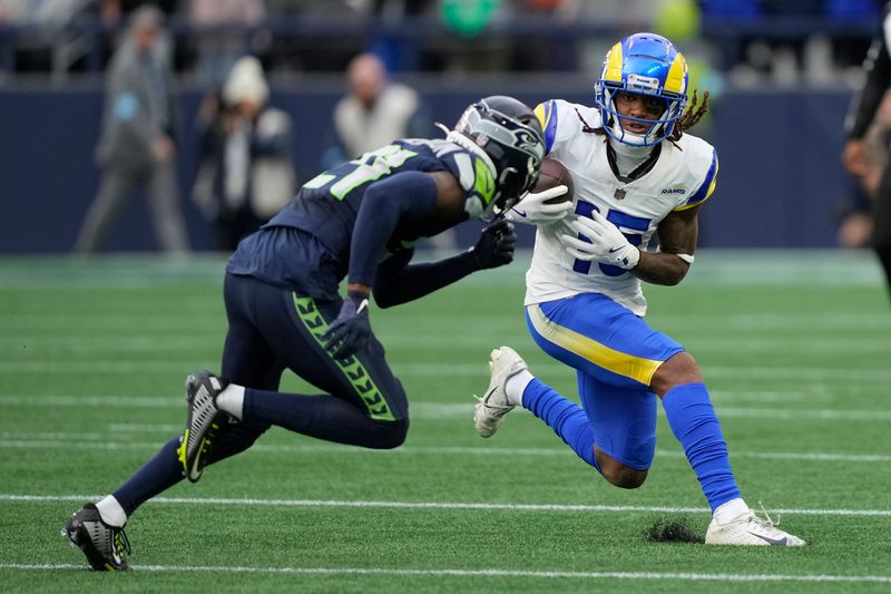 Los Angeles Rams wide receiver Demarcus Robinson, right, runs against the Seattle Seahawks during the second half of an NFL football game in Seattle, Sunday, Nov. 3, 2024. (AP Photo/Stephen Brashear)