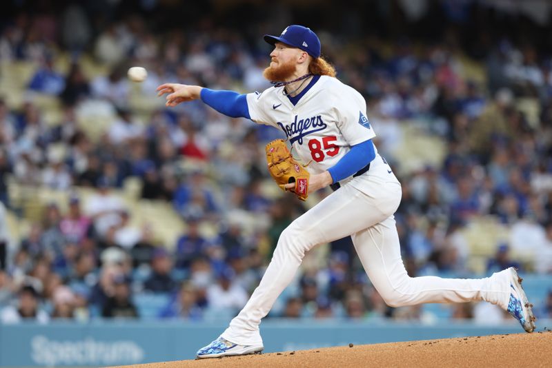Apr 28, 2025; Los Angeles, California, USA; Los Angeles Dodgers pitcher Dustin May (85) pitches in the first inning against the Miami Marlins during the first inning at Dodger Stadium. Mandatory Credit: Jason Parkhurst-Imagn Images