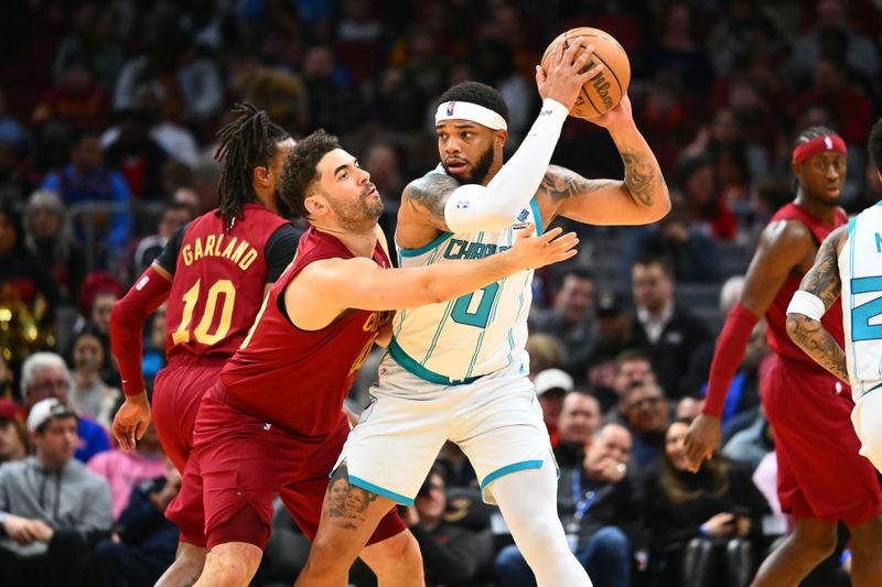 CLEVELAND, OHIO - MARCH 25: Georges Niang #20 of the Cleveland Cavaliers guards Miles Bridges #0 of the Charlotte Hornets during the first quarter at Rocket Mortgage Fieldhouse on March 25, 2024 in Cleveland, Ohio. NOTE TO USER: User expressly acknowledges and agrees that, by downloading and or using this photograph, User is consenting to the terms and conditions of the Getty Images License Agreement. (Photo by Jason Miller/Getty Images)