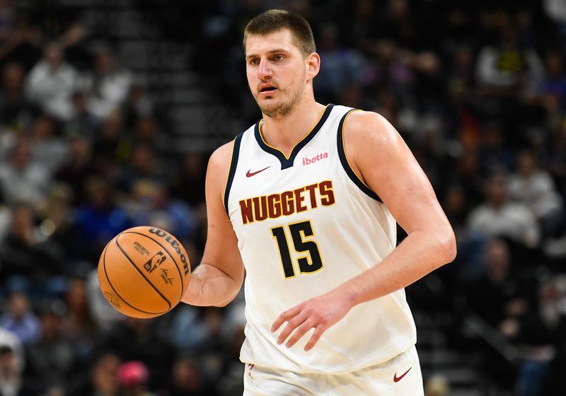 SALT LAKE CITY, UTAH - APRIL 09: Nikola Jokic #15 of the Denver Nuggets brings the ball up court in the second half against the Utah Jazz at Delta Center on April 09, 2024 in Salt Lake City, Utah. NOTE TO USER: User expressly acknowledges and agrees that, by downloading and or using this photograph, User is consenting to the terms and conditions of the Getty Images License Agreement.  (Photo by Alex Goodlett/Getty Images)