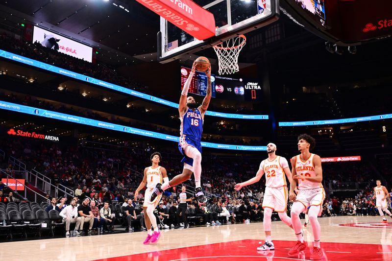 ATLANTA, GA - OCTOBER 14:  Caleb Martin #16 of the Philadelphia 76ers dunks the ball during the game against the Atlanta Hawks during a preseason game on October 14, 2024 at State Farm Arena in Atlanta, Georgia.  NOTE TO USER: User expressly acknowledges and agrees that, by downloading and/or using this Photograph, user is consenting to the terms and conditions of the Getty Images License Agreement. Mandatory Copyright Notice: Copyright 2024 NBAE (Photo by Adam Hagy/NBAE via Getty Images)