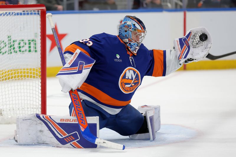 Dec 11, 2025; Elmont, New York, USA; New York Islanders goaltender David Rittich (33) makes a save against the Anaheim Ducks during the third period at UBS Arena. Mandatory Credit: Brad Penner-Imagn Images