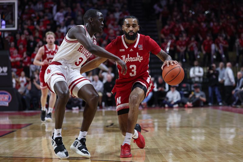 Jan 17, 2024; Piscataway, New Jersey, USA; Nebraska Cornhuskers guard Brice Williams (3) dribbles against Rutgers Scarlet Knights forward Mawot Mag (3) during the first half at Jersey Mike's Arena. Mandatory Credit: Vincent Carchietta-USA TODAY Sports