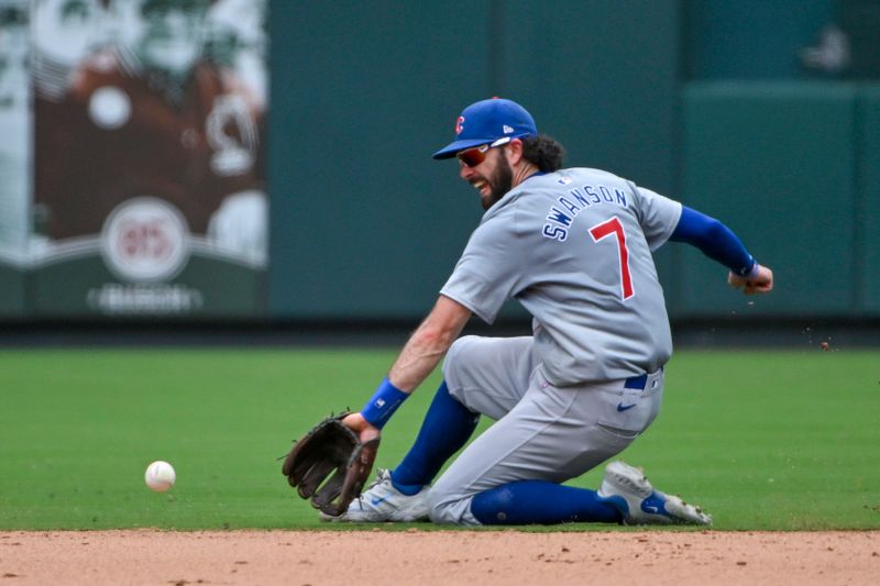 Jul 14, 2024; St. Louis, Missouri, USA;  Chicago Cubs shortstop Dansby Swanson (7) fields a ground ball against the St. Louis Cardinals during the seventh inning at Busch Stadium. Mandatory Credit: Jeff Curry-USA TODAY Sports