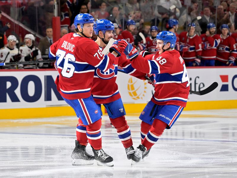 Dec 18, 2025; Montreal, Quebec, CAN; Montreal Canadiens forward Zack Bolduc (76) celebrates with teammates including defenseman Lane Hutson (48) after scoring a goal against the Chicago Blackhawks during the third period at the Bell Centre. Mandatory Credit: Eric Bolte-Imagn Images