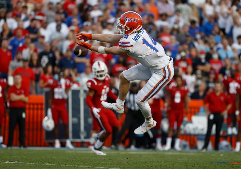 Sep 4, 2021; Gainesville, Florida, USA; Florida Gators wide receiver Trent Whittemore (14) attempts to catch the ball against the Florida Atlantic Owls during the first quarter at Ben Hill Griffin Stadium. Mandatory Credit: Kim Klement-USA TODAY Sports