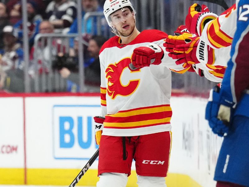 Dec 11, 2023; Denver, Colorado, USA; Calgary Flames defenseman Chris Tanev (88) celebrates his goal in the second period against the Colorado Avalanche at Ball Arena. Mandatory Credit: Ron Chenoy-USA TODAY Sports