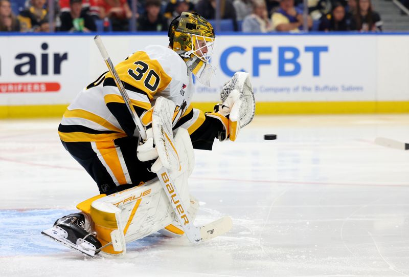 Sep 21, 2024; Buffalo, New York, USA;  Pittsburgh Penguins goalie Joel Blomqvist (30) looks to make a save during the second period against the Buffalo Sabres at KeyBank Center. Mandatory Credit: Timothy T. Ludwig-Imagn Images