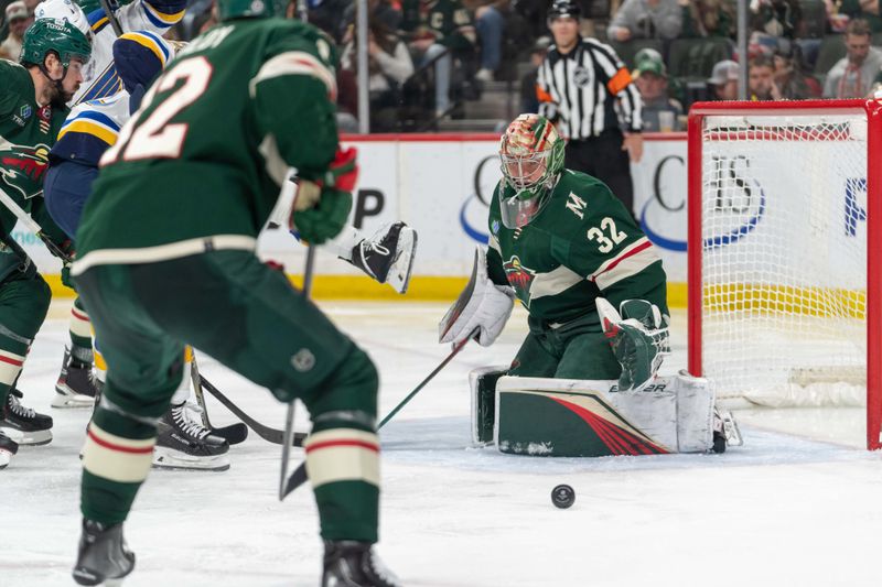 Apr 8, 2023; Saint Paul, Minnesota, USA; Minnesota Wild goaltender Filip Gustavsson (32) eyes a St. Louis Blues shot in the third period at Xcel Energy Center. Mandatory Credit: Matt Blewett-USA TODAY Sports