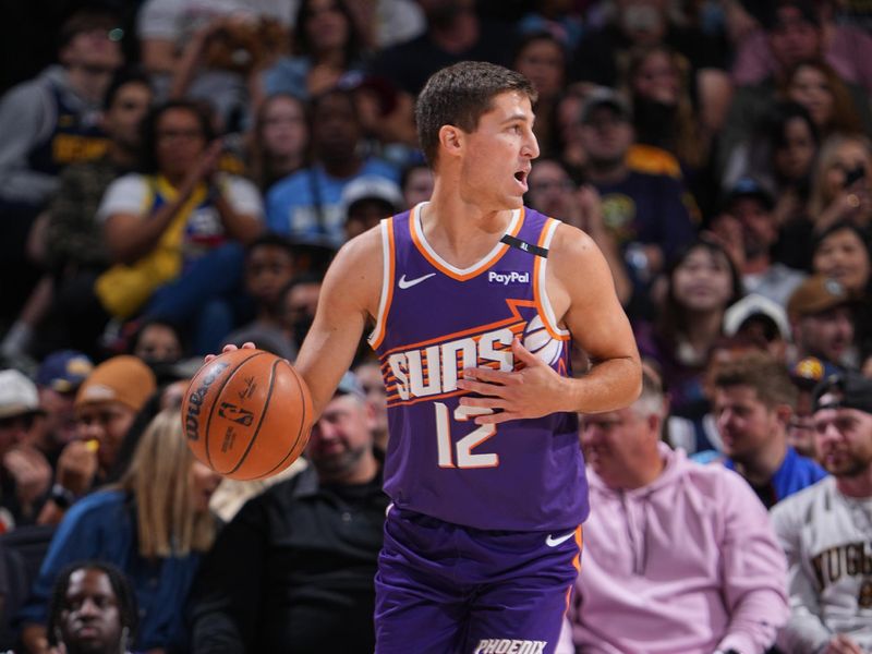 DENVER, CO - OCTOBER 13: Collin Gillespie #12 of the Phoenix Suns dribbles the ball during the game against the Denver Nuggets on October 13, 2024 at Ball Arena in Denver, Colorado. NOTE TO USER: User expressly acknowledges and agrees that, by downloading and/or using this Photograph, user is consenting to the terms and conditions of the Getty Images License Agreement. Mandatory Copyright Notice: Copyright 2024 NBAE (Photo by Garrett Ellwood/NBAE via Getty Images)