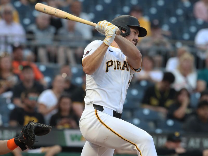 Jun 4, 2025; Pittsburgh, Pennsylvania, USA;  Pittsburgh Pirates right fielder Bryan Reynolds (10) hits a single against the Houston Astros during the fifth inning at PNC Park. Mandatory Credit: Charles LeClaire-Imagn Images