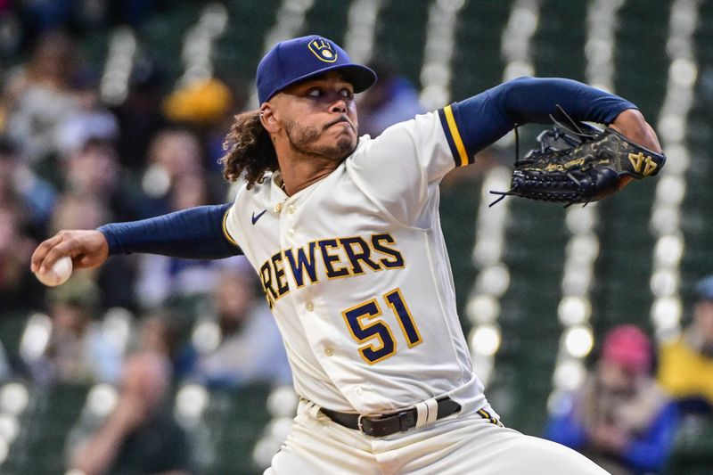 Apr 26, 2023; Milwaukee, Wisconsin, USA; Milwaukee Brewers pitcher Freddy Peralta (51) throws a pitch in the first inning against the Detroit Tigers at American Family Field. Mandatory Credit: Benny Sieu-USA TODAY Sports