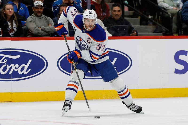Jan 16, 2025; Denver, Colorado, USA; Edmonton Oilers center Connor McDavid (97) controls the puck in the third period against the Colorado Avalanche at Ball Arena. Mandatory Credit: Isaiah J. Downing-Imagn Images