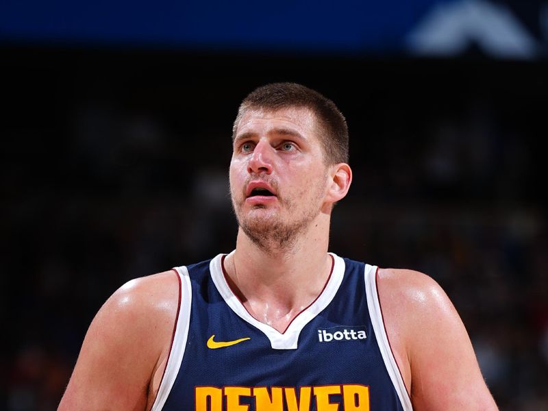 DENVER, CO - APRIL 10: Nikola Jokic #15 of the Denver Nuggets shoots a free throw during the game against the Minnesota Timberwolves on April 10, 2024 at the Ball Arena in Denver, Colorado. NOTE TO USER: User expressly acknowledges and agrees that, by downloading and/or using this Photograph, user is consenting to the terms and conditions of the Getty Images License Agreement. Mandatory Copyright Notice: Copyright 2024 NBAE (Photo by Garrett Ellwood/NBAE via Getty Images)