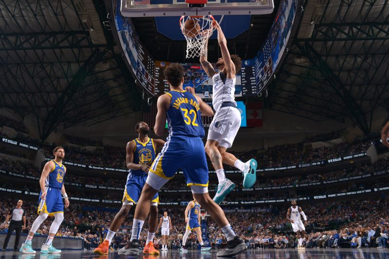 DALLAS, TX - MARCH 13: Dereck Lively II #2 of the Dallas Mavericks dunks the ball during the game against the Golden State Warriors on March 13, 2024 at the American Airlines Center in Dallas, Texas. NOTE TO USER: User expressly acknowledges and agrees that, by downloading and or using this photograph, User is consenting to the terms and conditions of the Getty Images License Agreement. Mandatory Copyright Notice: Copyright 2024 NBAE (Photo by Glenn James/NBAE via Getty Images)