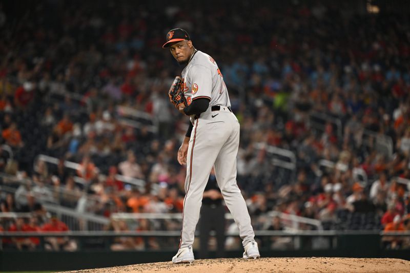 May 8, 2024; Washington, District of Columbia, USA; Baltimore Orioles pitcher Yennier Cano (78) takes a look at first base against the Washington Nationals during the seventh inning at Nationals Park. Mandatory Credit: Rafael Suanes-USA TODAY Sports